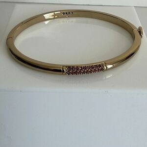 DKNY Oval Gold Tone Pink Crystal Hinged Bangle Bracelet